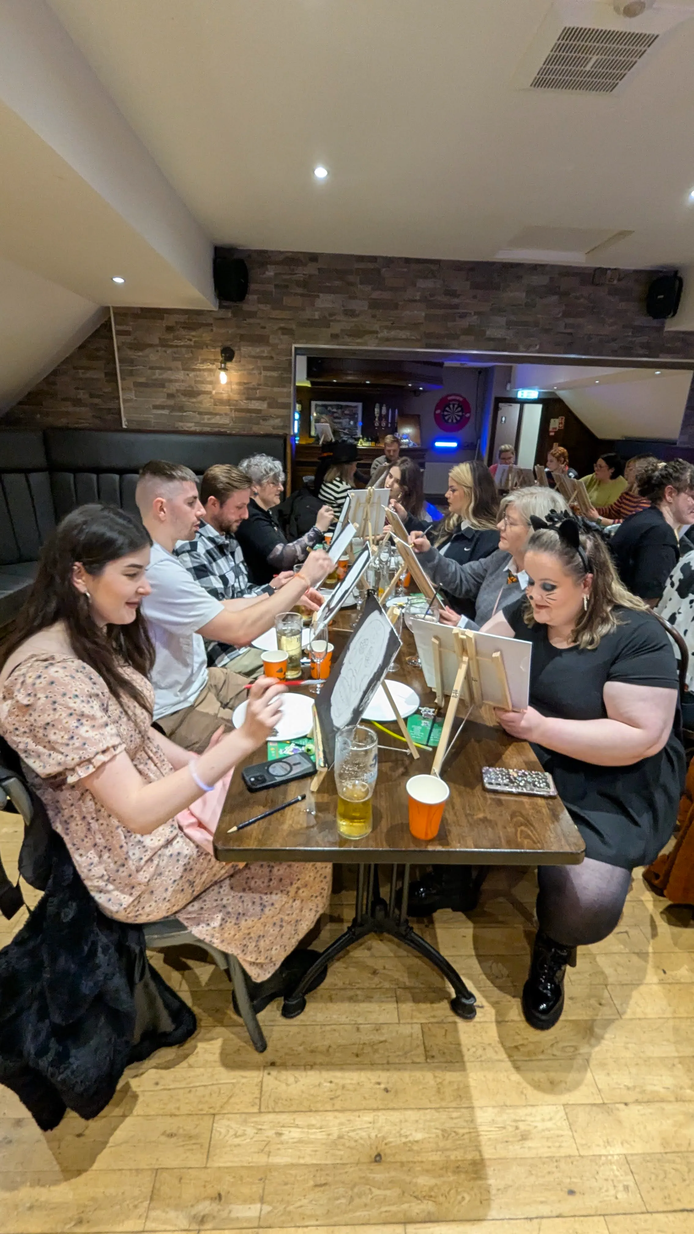 Creative Irish language workshop atmosphere at a Tuathan event Belfast